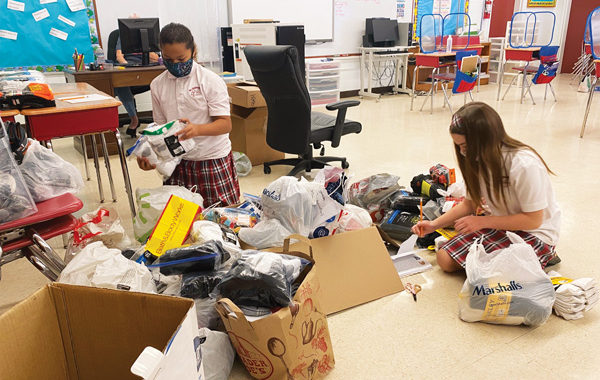 Fifth graders’ Socktober drive warms the hearts and feet of area homeless
