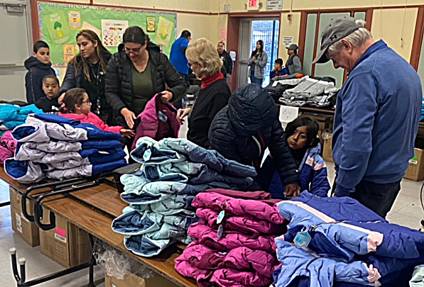 First graders in Concord get warm coats at Knights of Columbus Christmas party