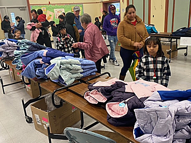 First graders in Concord get warm coats at Knights of Columbus Christmas party